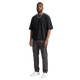 NILO Director snow-washed black boxy tee with raw edges in heavyweight cotton worn by a man