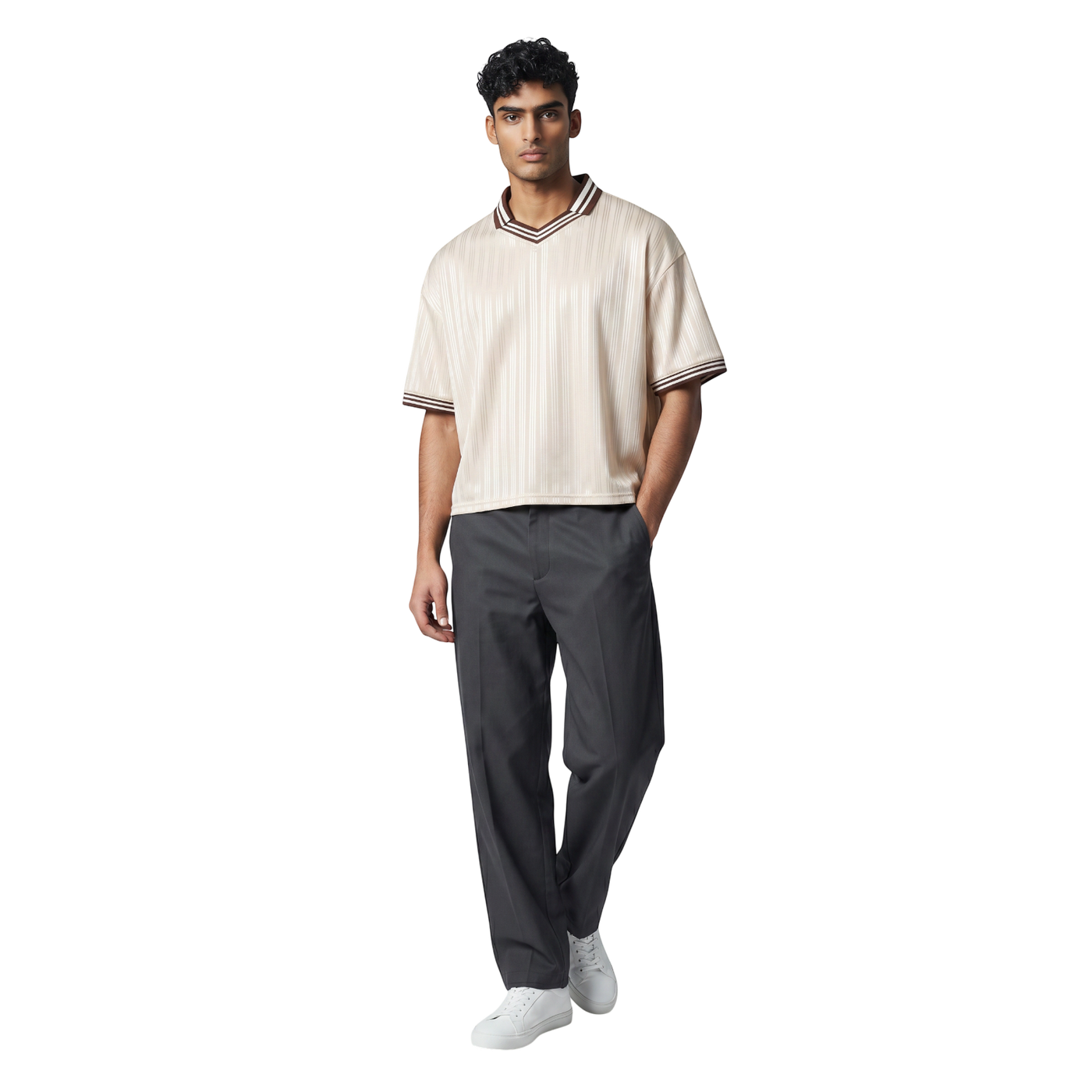NILO Sequence striped polo tee in cream with brown trim, worn by a male model with dark grey trousers and white shoes.