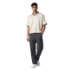 NILO Sequence striped polo tee in cream with brown trim, worn by a male model with dark grey trousers and white shoes.