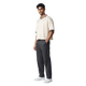 NILO Sequence striped polo tee in cream with brown trim worn by a male model with dark grey trousers and white sneakers