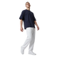 NILO Studio Heavyweight Tee in navy blue cotton with drop shoulders worn by a model with white joggers and sneakers.