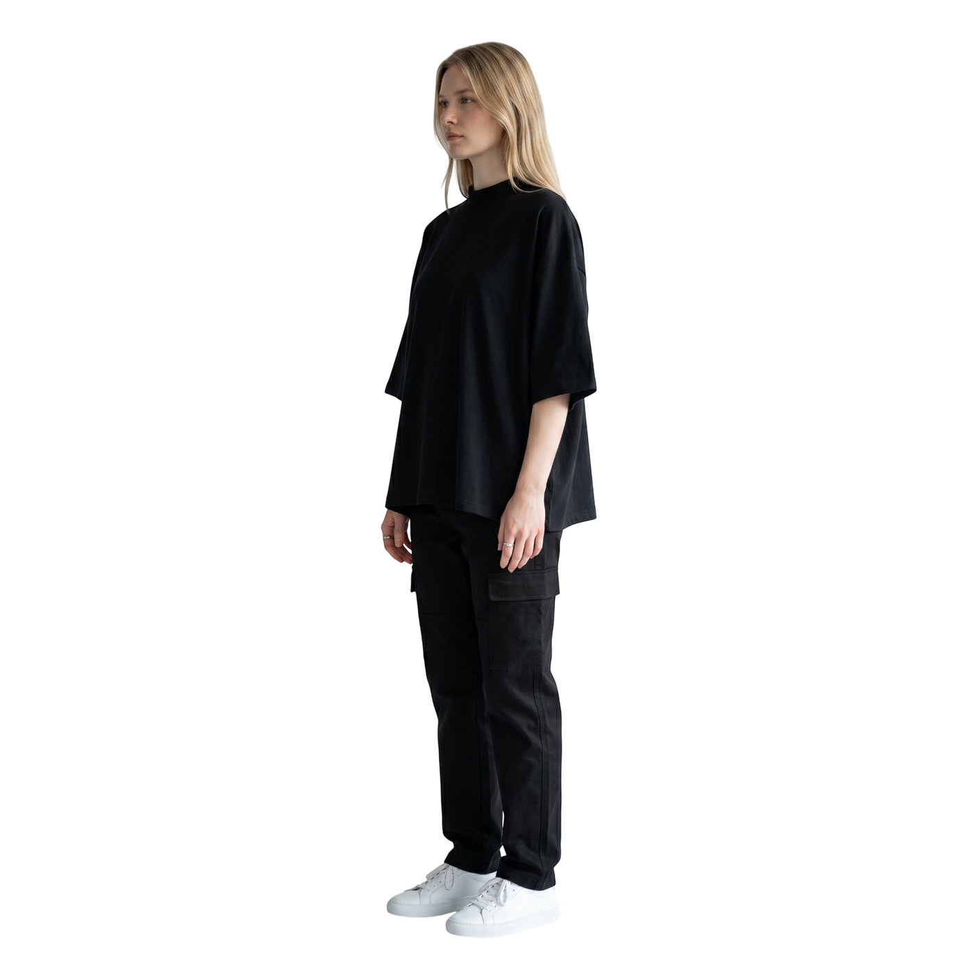 NILO Vision oversized black boxy tee in heavyweight cotton worn by a model in a side profile view