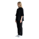 NILO Vision oversized black boxy tee in heavyweight cotton worn by a model in a side profile view